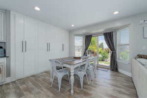 Dining area with light hardwood / wood-style floors