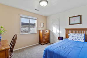 View of carpeted bedroom