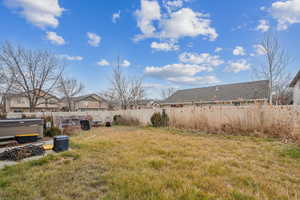 View of yard with a hot tub