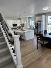 Kitchen with a wealth of natural light, stainless steel appliances, and a textured ceiling