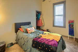 Bedroom with carpet flooring and ceiling fan