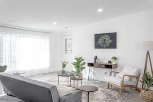 Living room with hardwood / wood-style flooring