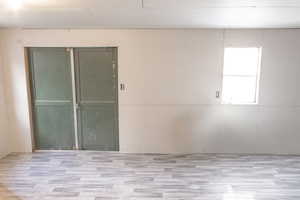 Empty room featuring light wood-type flooring