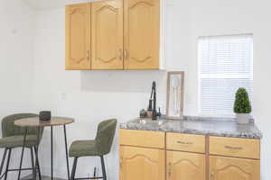 Kitchen featuring sink, a healthy amount of sunlight, and light brown cabinets