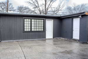 Property entrance with a patio area