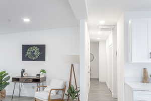 Corridor featuring light hardwood / wood-style flooring