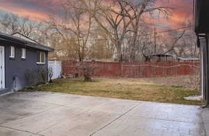 Yard at dusk with a patio