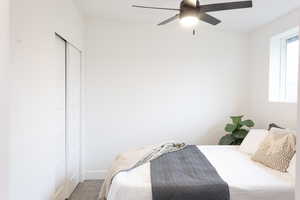 Bedroom with carpet and ceiling fan