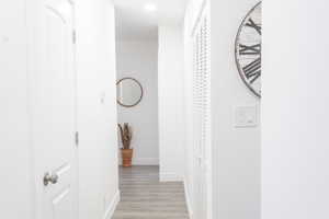 Hall featuring light hardwood / wood-style flooring