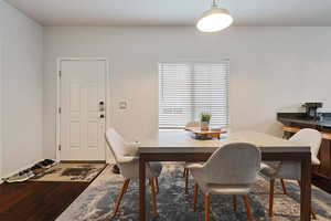 Dining space with wood-type flooring