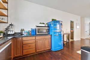 Kitchen with dark hardwood / wood-style flooring