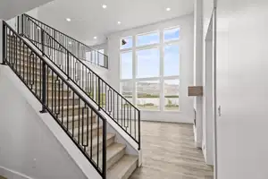 Stairs with a mountain view and hardwood / wood-style flooring