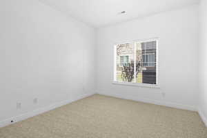 View of carpeted spare room