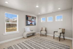 Sitting room featuring a textured ceiling, recessed lighting, visible vents, baseboards, and carpet