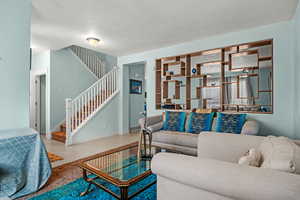 Living room with light tile patterned floors