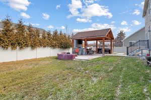 View of yard featuring a patio and a gazebo