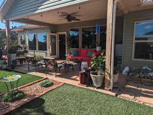 View of patio with ceiling fan and an outdoor hangout area