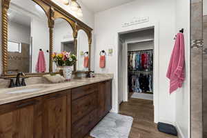 Bathroom featuring hardwood / wood-style floors and vanity