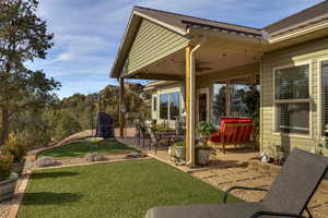 View of patio featuring ceiling fan