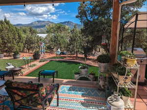 View of patio featuring a mountain view and an outdoor living space