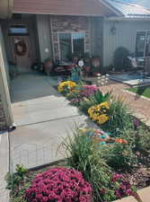 Doorway to property with a patio area