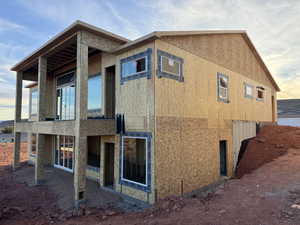 View of property exterior at dusk