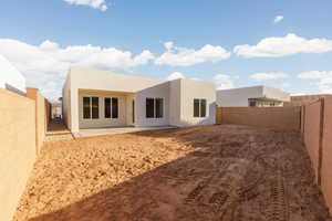 Rear view of property with a patio