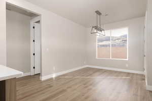 Unfurnished dining area with light wood-type flooring