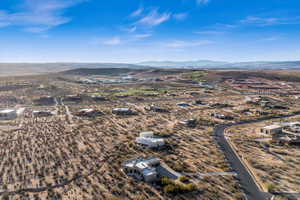 Birds eye view of property with a mountain view