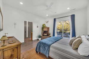 Bedroom featuring hardwood / wood-style flooring and ceiling fan