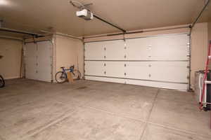 Garage featuring a garage door opener