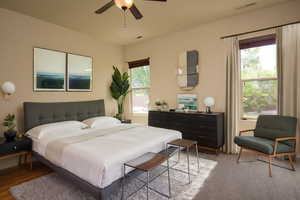 Bedroom with ceiling fan and light hardwood / wood-style flooring