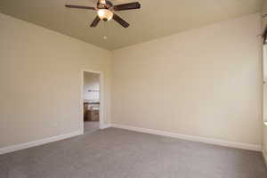 Unfurnished room with carpet and ceiling fan