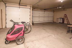 Garage featuring a garage door opener