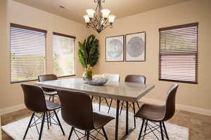 Dining area featuring an inviting chandelier