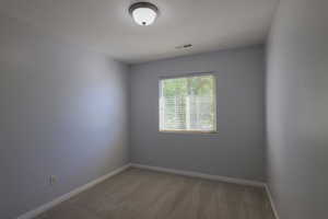 Unfurnished room featuring carpet floors