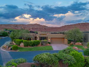 Southwest-style home with a mountain view and a garage