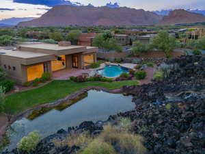 Exterior space featuring a mountain view, a yard, and a patio