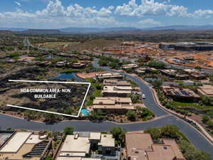 Drone / aerial view featuring a water and mountain view