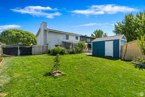 View of yard featuring a storage shed