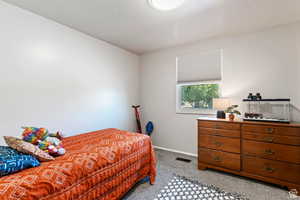 View of carpeted bedroom