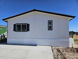 View of side of property featuring a patio