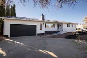 Ranch-style home with a garage