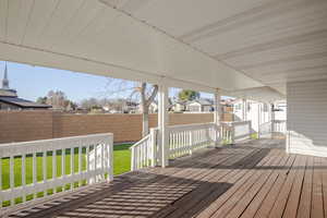 Wooden deck featuring a yard