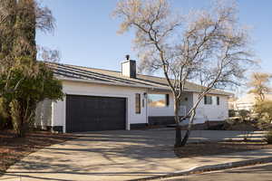 Single story home with a garage