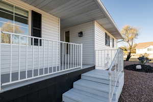 View of exterior entry featuring a porch