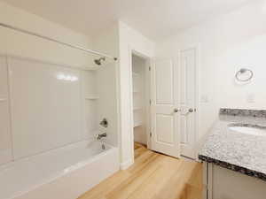 2nd bedroom suite attached bathroom with tub/shower combination unit and linen closet