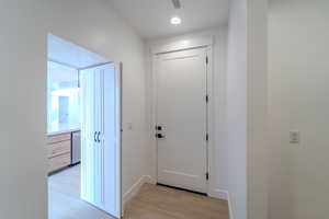 Hallway featuring light hardwood / wood-style flooring