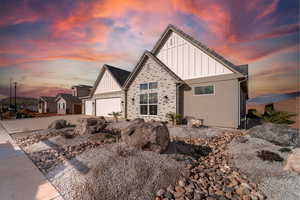 View of front of property featuring a garage