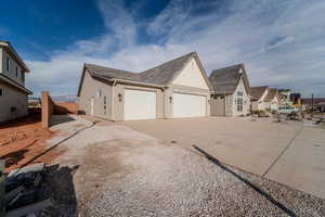 View of side of home featuring a garage